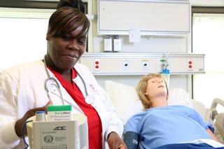 Student pursing an associate degree nursing in classroom at Donnelly College. They are in programs such associate degrees, bachelor's degrees such as business leadership and information systems and information technology or nursing programs. Students get scholarships and financial aid at Donnelly which helps to make Donnelly the most affordable private college in Kansas or Missouri. 